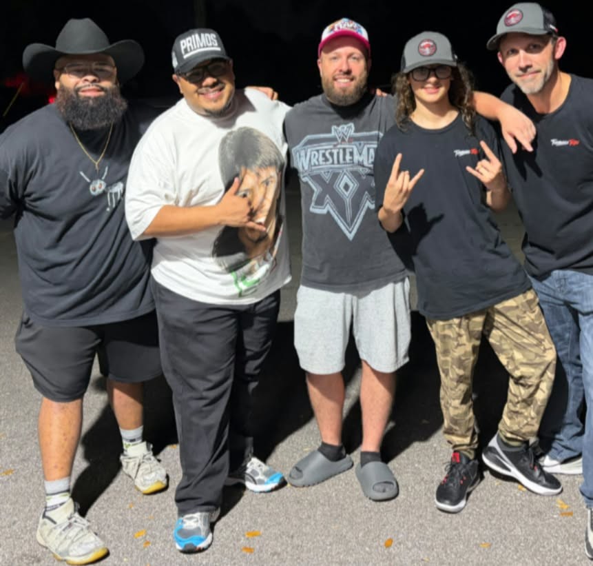 Trystan of Turnbuckle Tribe throwing up the horns with wrestling content creators Fatherless, Primos4Life, and Allenownz and Dan of Turnbuckle Tribe
